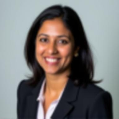 Professional headshot of Priya Sharma.